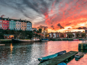 Houses over a river at dusk